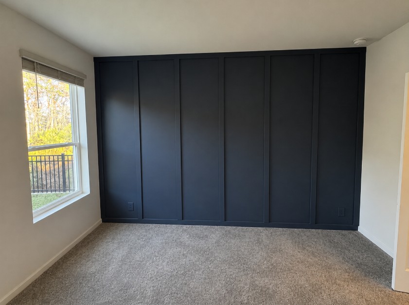 Navy board and batten accent wall after installation